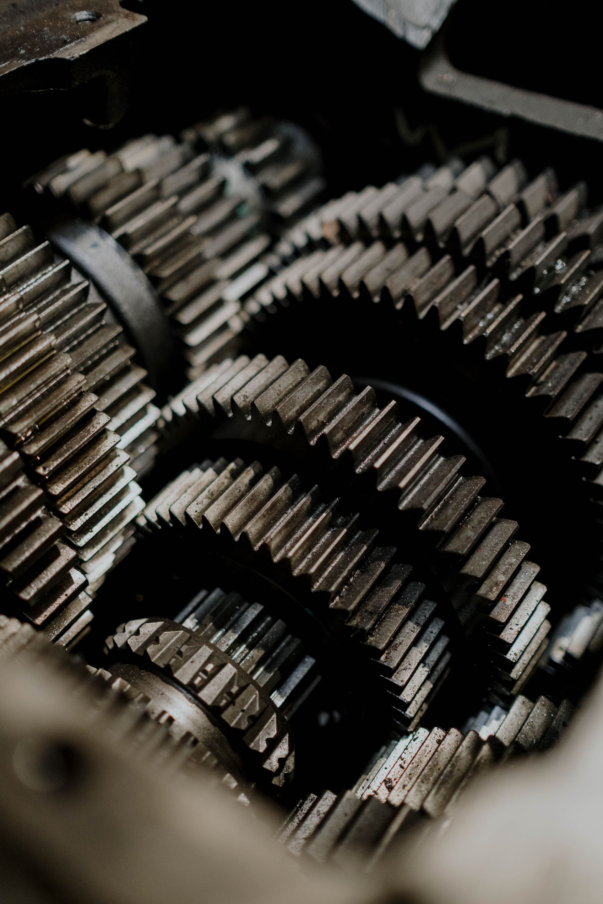 Detailed close-up of metal gears inside a machine showcasing precision engineering.